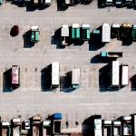 bird eye view of lorries parked up in a parking lot.