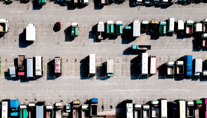 bird eye view of lorries parked up in a parking lot.